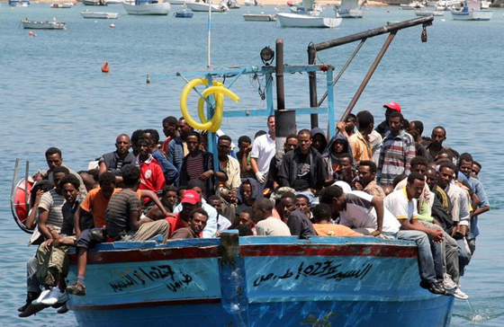 Would-be immigrants arrive on a boat in