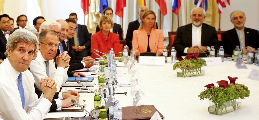 Iranian Foreign Minister Zarif sits next to EU High Representative for Foreign Affairs Mogherini as they meet with foreign ministers from the U.S., France, Russia, Germany, China and Britain in Vienna